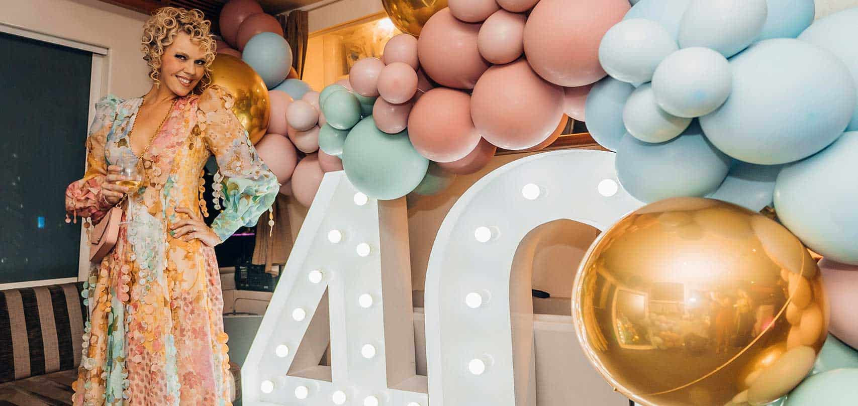 A balloon garland and light up numbers for a 40th birthday party.