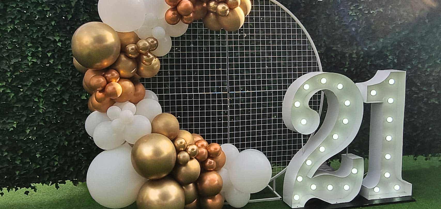 Hire the Plus package - a balloon garland on a mesh frame with giant light up numbers.